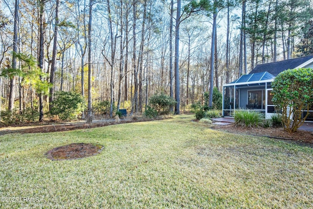 view of yard with a sunroom