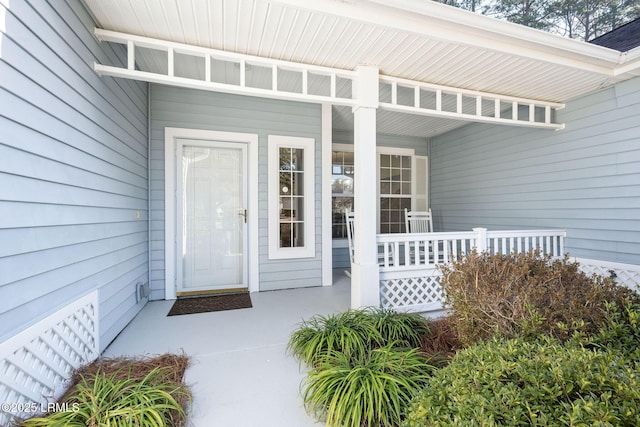 doorway to property with covered porch