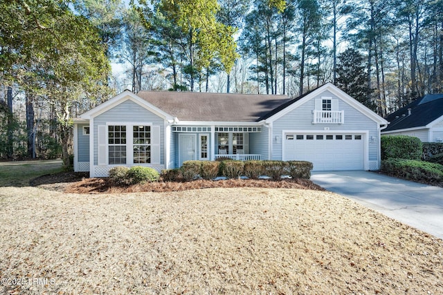 ranch-style home featuring a garage and covered porch