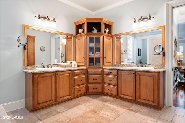 10 Anchor Bay Ct, Bluffton, SC 29910 - bathroom featuring double vanity, stone tile floors, and ornamental molding
