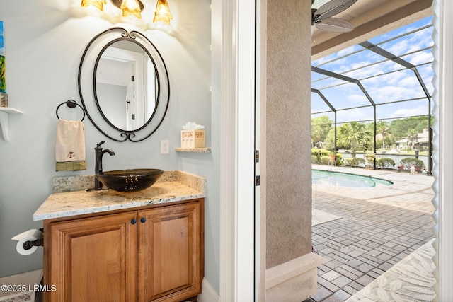 10 Anchor Bay Ct, Bluffton, SC 29910 - bathroom with vanity, a ceiling fan, and brick patterned flooring