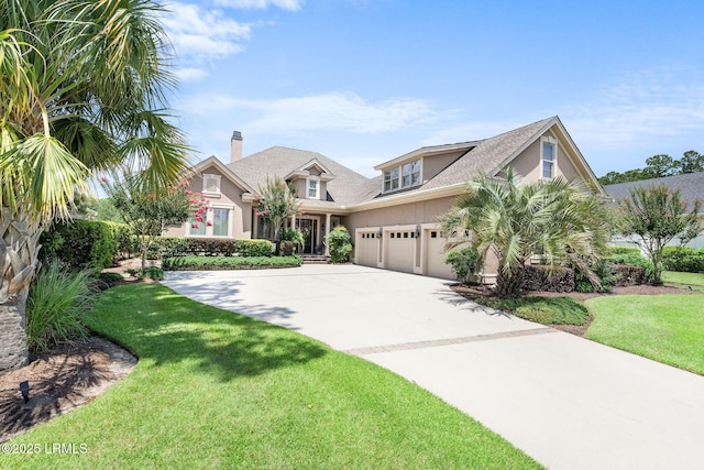 10 Anchor Bay Ct, Bluffton, SC 29910 - view of front of property featuring driveway, stucco siding, a front yard, and an attached garage