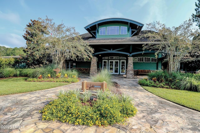 10 Anchor Bay Ct, Bluffton, SC 29910 - rear view of house with french doors, a lawn, and covered porch
