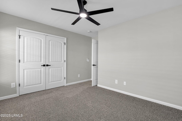 unfurnished bedroom with carpet flooring, ceiling fan, and a closet