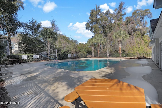 view of swimming pool featuring a patio area