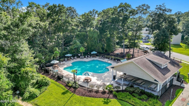 view of pool with a yard and a patio area