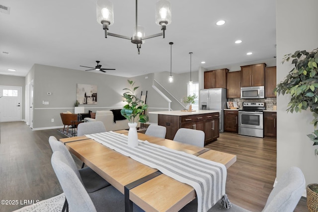 dining room featuring ceiling fan and dark hardwood / wood-style flooring