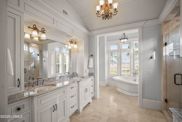 1448 Gleasons Landing Dr, Saint Helena Island, SC 29920 - bathroom with an inviting chandelier, a shower stall, a sink, and visible vents