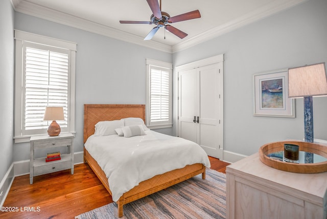 1448 Gleasons Landing Dr, Saint Helena Island, SC 29920 - bedroom with crown molding, baseboards, wood finished floors, and a closet
