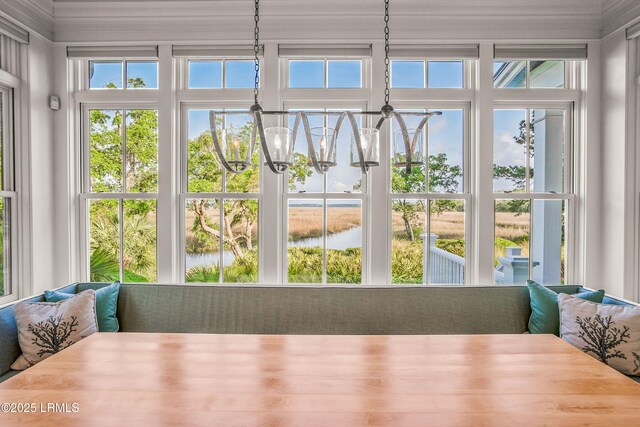 1448 Gleasons Landing Dr, Saint Helena Island, SC 29920 - sunroom with a water view and an inviting chandelier