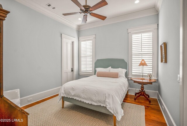 1448 Gleasons Landing Dr, Saint Helena Island, SC 29920 - bedroom featuring baseboards, ornamental molding, wood finished floors, and visible vents