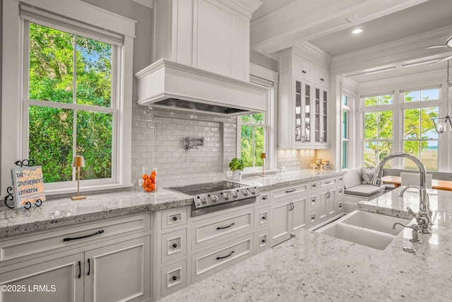 1448 Gleasons Landing Dr, Saint Helena Island, SC 29920 - kitchen with a sink, white cabinetry, electric cooktop, and decorative backsplash