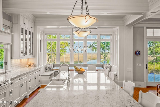 1448 Gleasons Landing Dr, Saint Helena Island, SC 29920 - sunroom featuring a sink, a water view, and plenty of natural light
