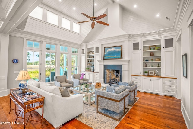 1448 Gleasons Landing Dr, Saint Helena Island, SC 29920 - living area featuring ceiling fan, built in shelves, hardwood / wood-style floors, and high vaulted ceiling