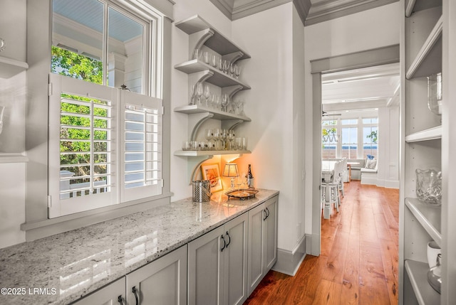 1448 Gleasons Landing Dr, Saint Helena Island, SC 29920 - bar with baseboards, ornamental molding, a bar, and light wood-style floors