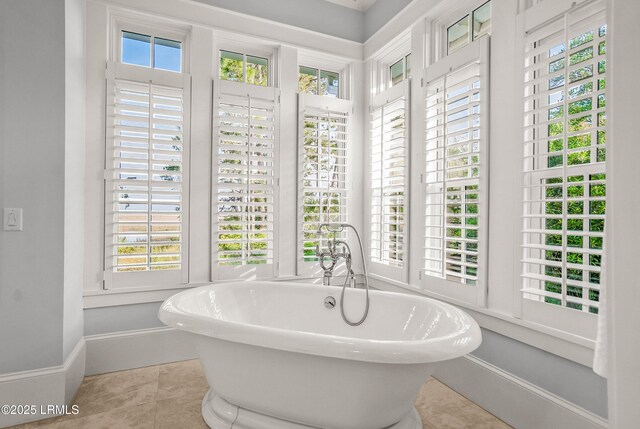 1448 Gleasons Landing Dr, Saint Helena Island, SC 29920 - full bath with baseboards, a freestanding bath, and tile patterned floors