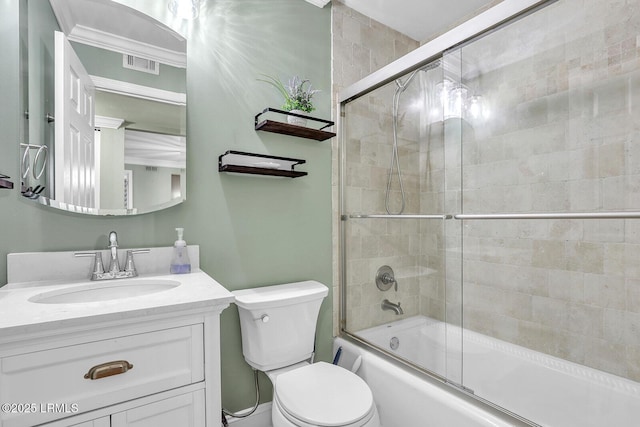 full bath featuring enclosed tub / shower combo, visible vents, vanity, and toilet