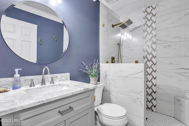 bathroom featuring vanity, toilet, and a walk in shower