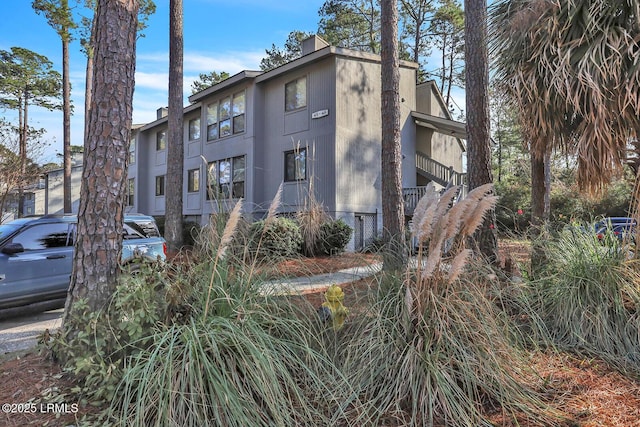 view of property exterior with a chimney