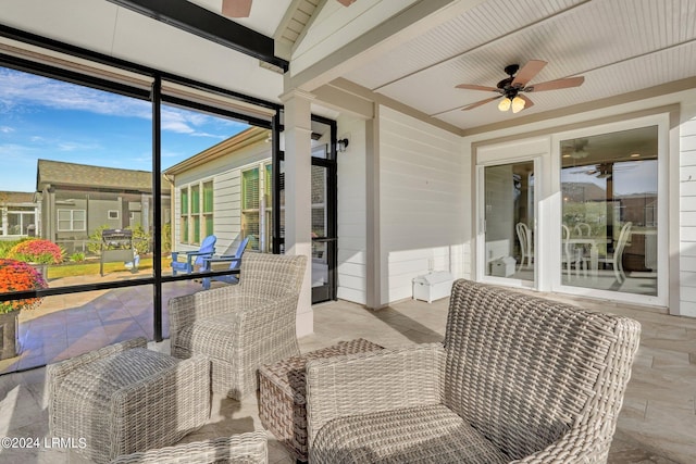 sunroom / solarium with ceiling fan