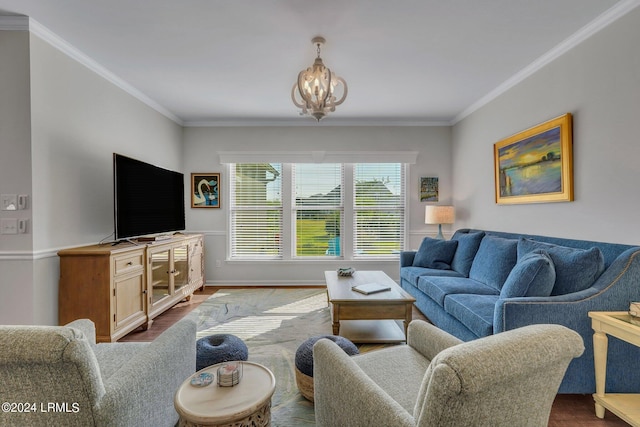 living room featuring ornamental molding, hardwood / wood-style floors, and a notable chandelier