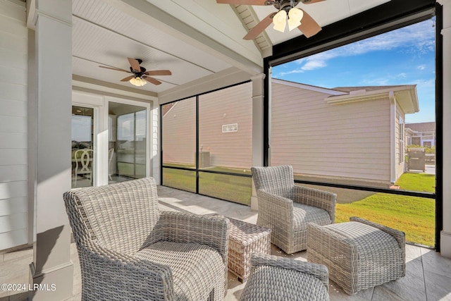 sunroom / solarium with lofted ceiling and ceiling fan