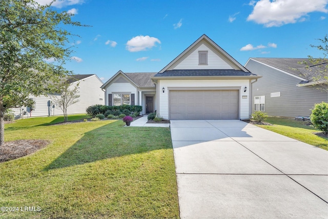 view of front of home with a garage and a front yard