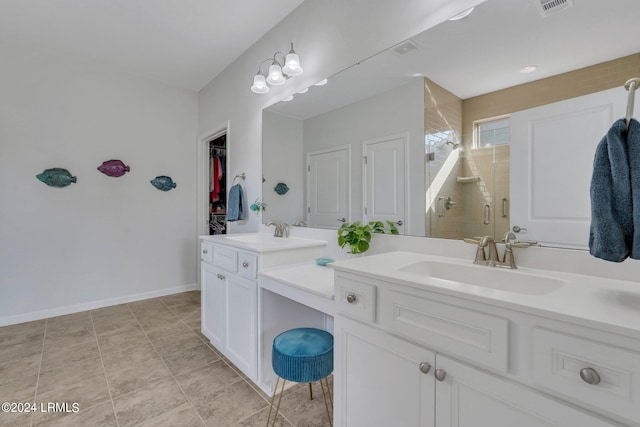 bathroom with walk in shower and vanity