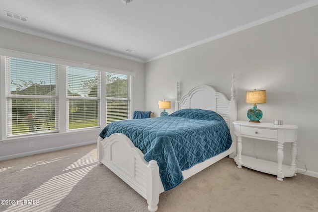 bedroom featuring crown molding and carpet flooring