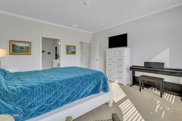 carpeted bedroom with ensuite bath and ornamental molding