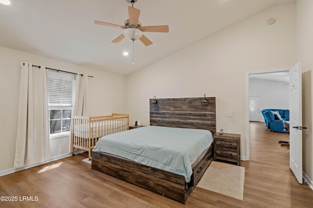 bedroom featuring lofted ceiling, wood finished floors, recessed lighting, a ceiling fan, and baseboards
