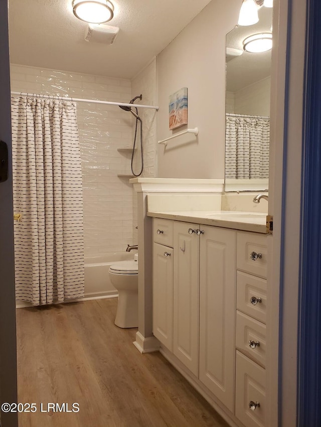 70 Helmsman Way Unit 1410, Hilton Head Island, SC 29928 - full bathroom featuring vanity, wood finished floors, and shower / bath combo with shower curtain