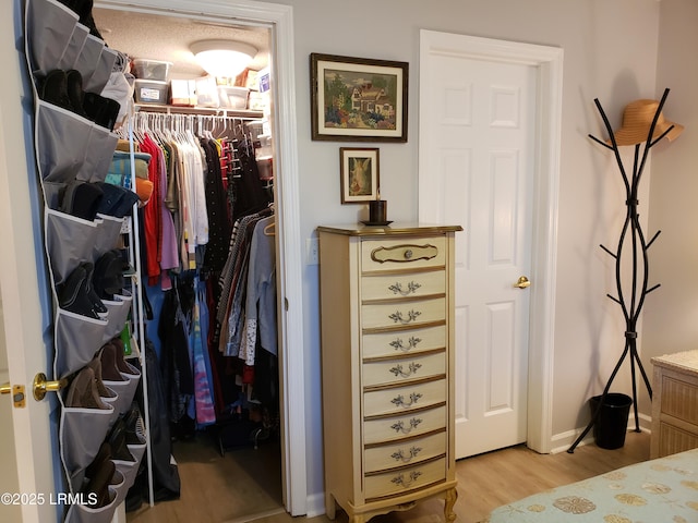 70 Helmsman Way Unit 1410, Hilton Head Island, SC 29928 - bedroom with light wood-type flooring and a closet
