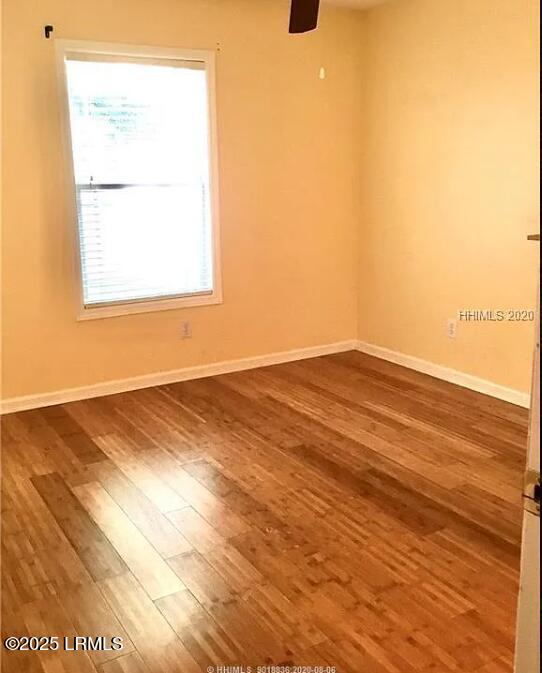14 Arbormeade Cir, Bluffton, SC 29910 - unfurnished room with dark wood-type flooring and ceiling fan