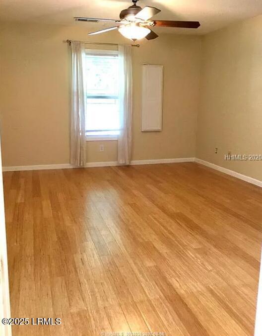 14 Arbormeade Cir, Bluffton, SC 29910 - unfurnished room with light wood finished floors and ceiling fan