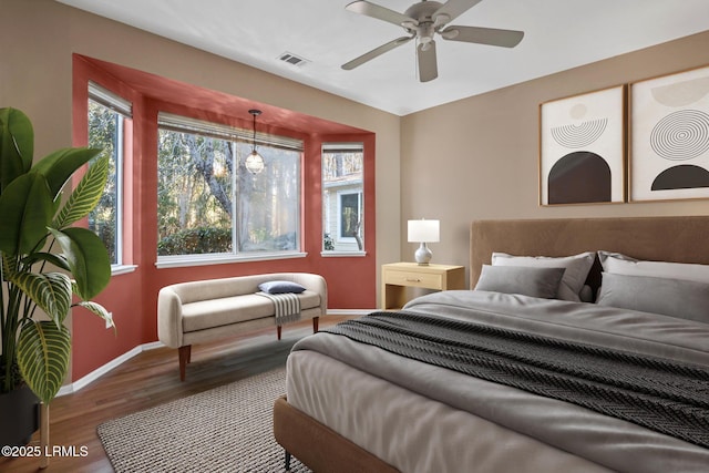 bedroom featuring ceiling fan and hardwood / wood-style floors