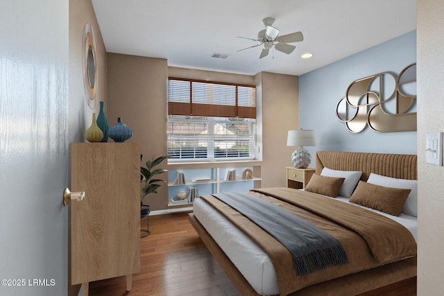 bedroom featuring hardwood / wood-style flooring and ceiling fan