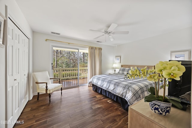 bedroom featuring dark wood-type flooring, ceiling fan, a closet, and access to outside