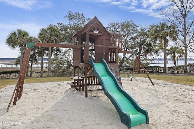 view of jungle gym featuring a water view