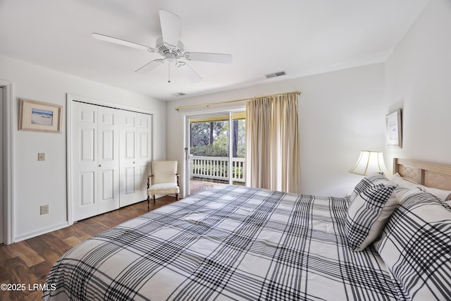 bedroom with dark wood-type flooring, access to outside, ceiling fan, and a closet