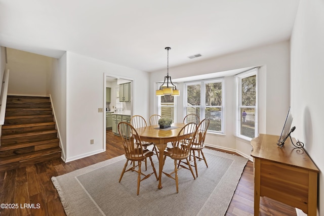 dining room featuring dark hardwood / wood-style flooring