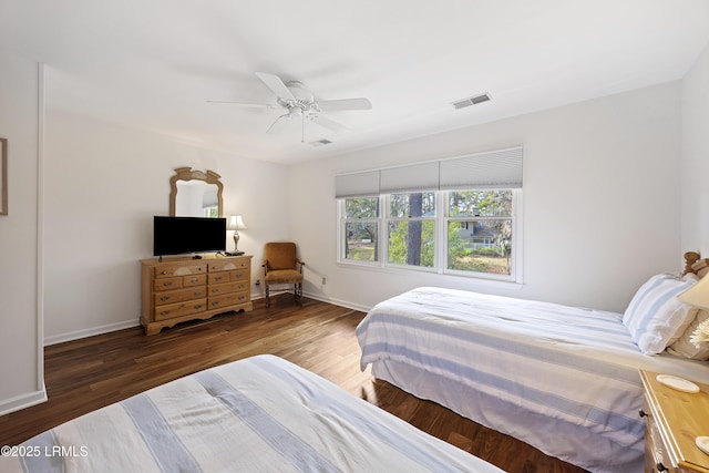 bedroom featuring dark wood-type flooring and ceiling fan