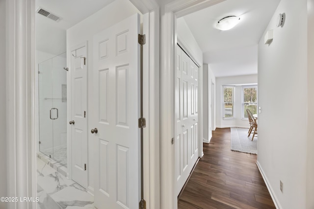 hall with dark hardwood / wood-style flooring