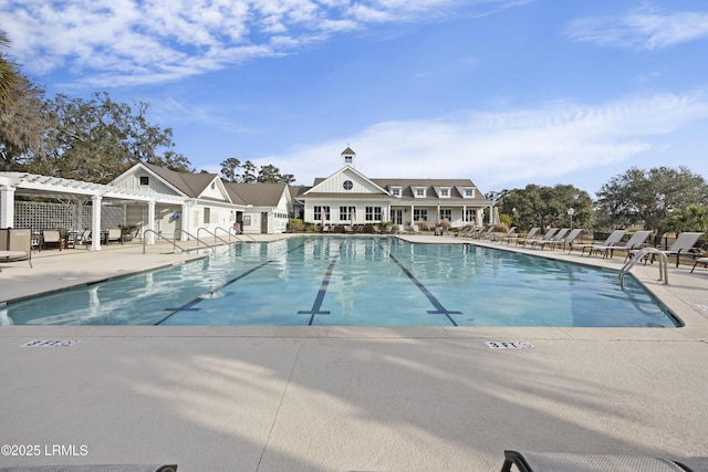 view of pool with a pergola and a patio