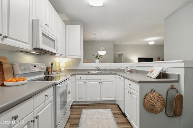 100 Kensington Blvd Unit 1503, Bluffton, SC 29910 - kitchen with white appliances, a sink, dark wood finished floors, and white cabinetry