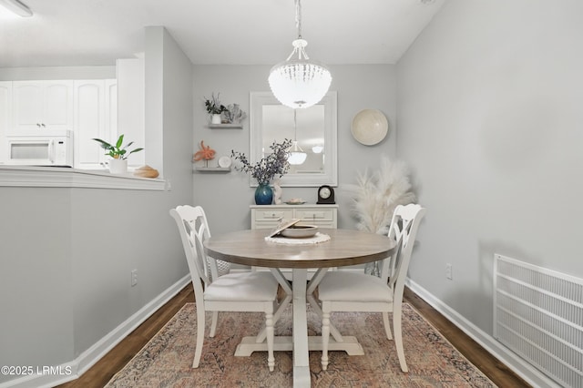 100 Kensington Blvd Unit 1503, Bluffton, SC 29910 - dining room featuring dark wood-style flooring and baseboards