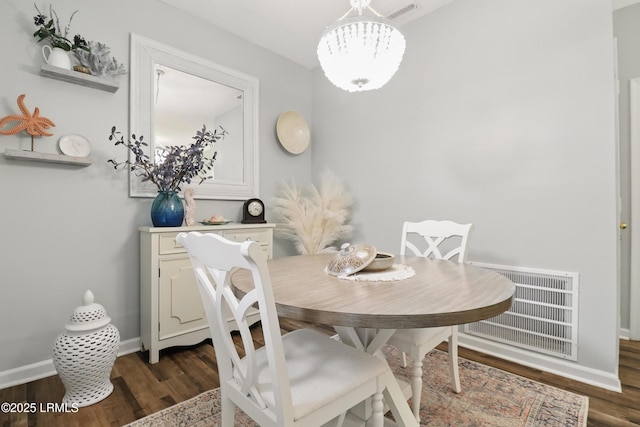 100 Kensington Blvd Unit 1503, Bluffton, SC 29910 - dining area with dark wood-style flooring, a chandelier, and baseboards