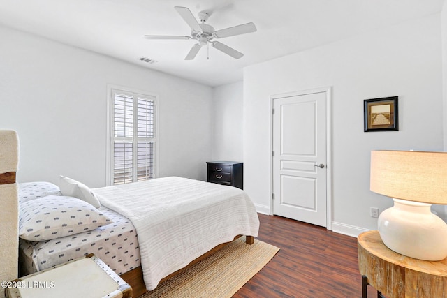 bedroom featuring ceiling fan and dark hardwood / wood-style floors