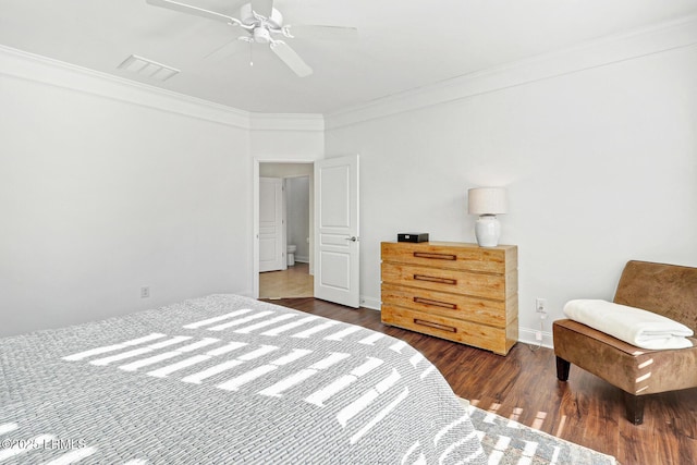 bedroom with crown molding, ceiling fan, and dark hardwood / wood-style floors