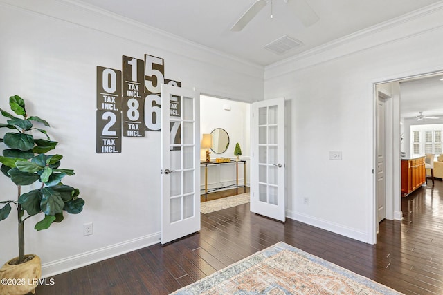 interior space with crown molding, dark hardwood / wood-style flooring, and french doors